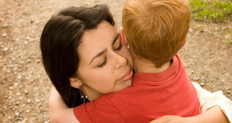 Woman hugging boy