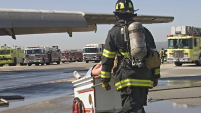 Fire fighter headed to help on runway