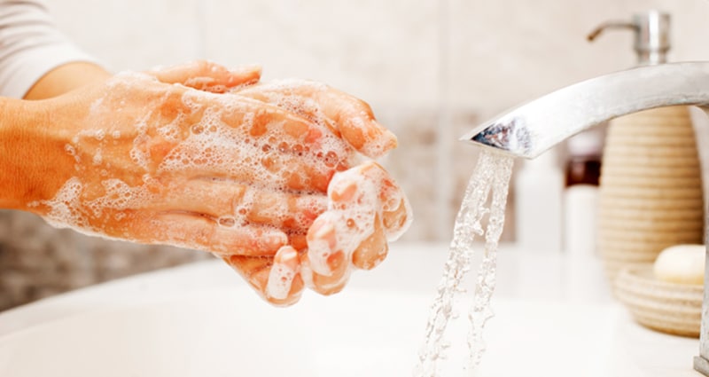 Washing hands with soap and water