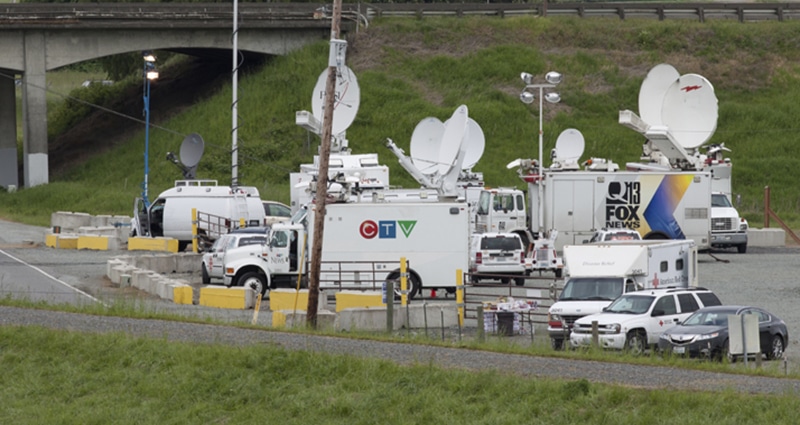 Media trucks lined up outside