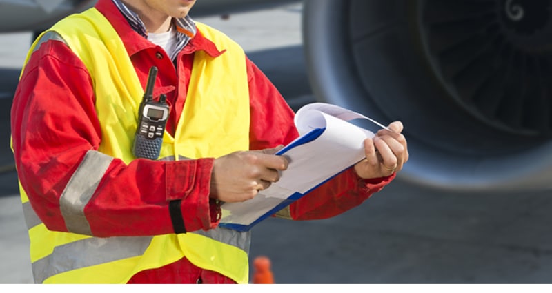 Man with safety vest and clipboard