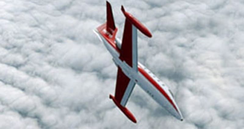 Futuristic plane flying above clouds