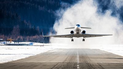 Jet plane landing on snowy runway