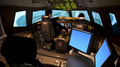 Two pilots in a flight simulator