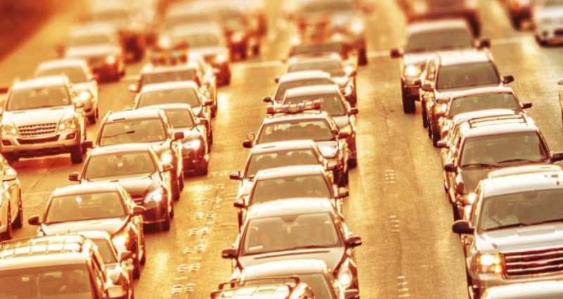 Highway traffic at sunset.