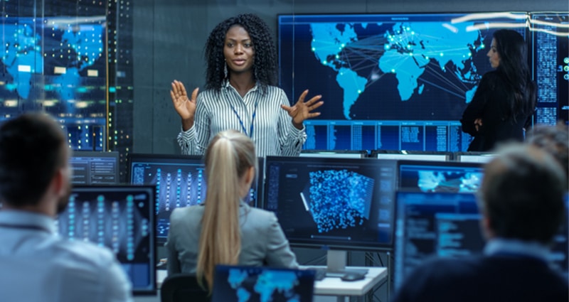 Woman addressing cyber concerns to coworkers