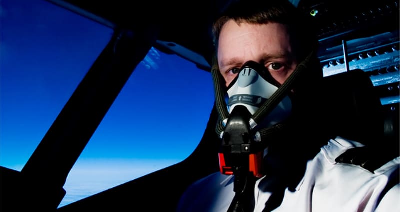 Pilot flying while wearing oxygen mask