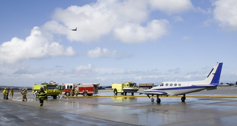 Emergency crews tending to aircraft on runway