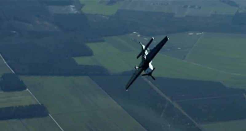 Prop plane doing a barrel roll