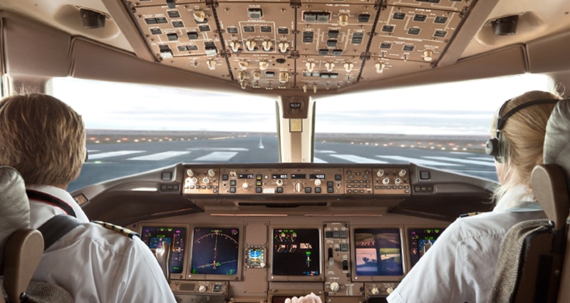 Man and woman pilot taxiing