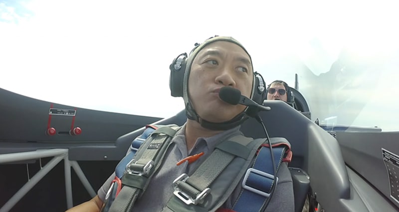 Pilot in cockpit looking out to his left