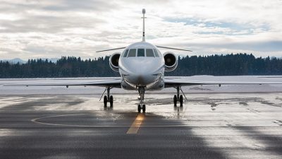 Front view of business jet on runway