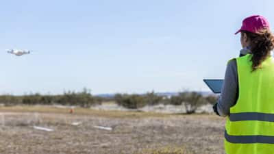 Woman performing control tasks with drone.