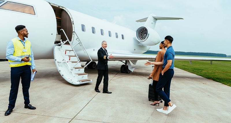 Aircraft crew meeting passengers.