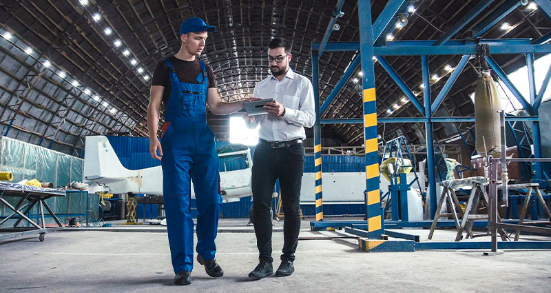 Mechanic and flight engineer having a discussion