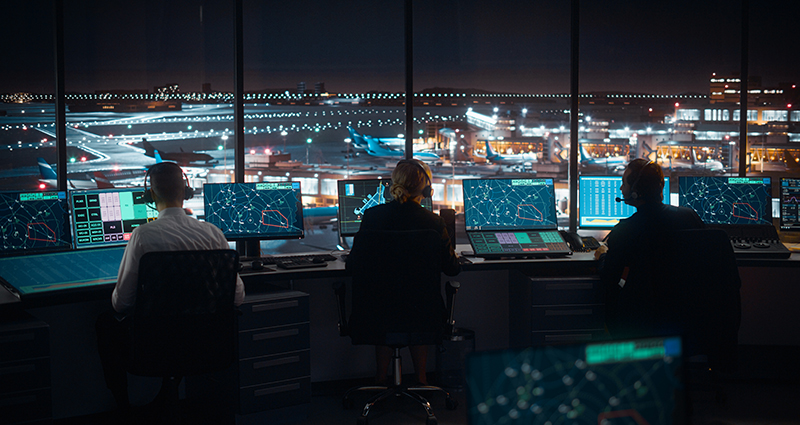 Air traffic control team working in airport tower