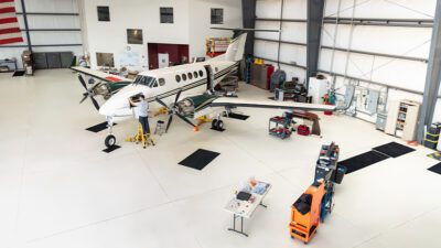 mechanic working on aircraft in hangar