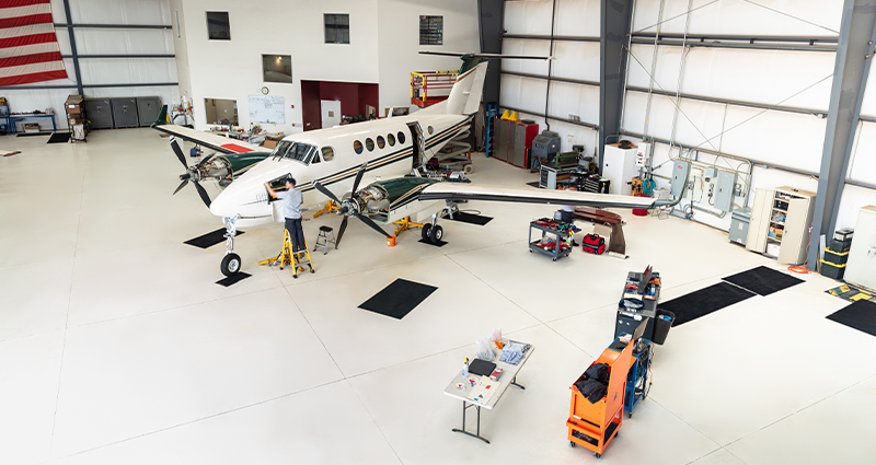 mechanic working on aircraft in hangar