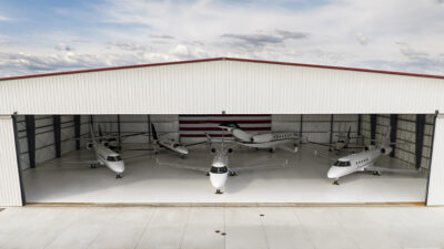 Airplane Hangar With Private Jets Parked Inside