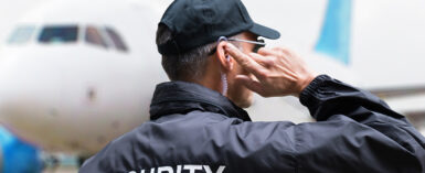 airport security guard listening to earpiece