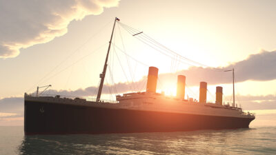 historic passenger ship Titanic on the high seas at sunset